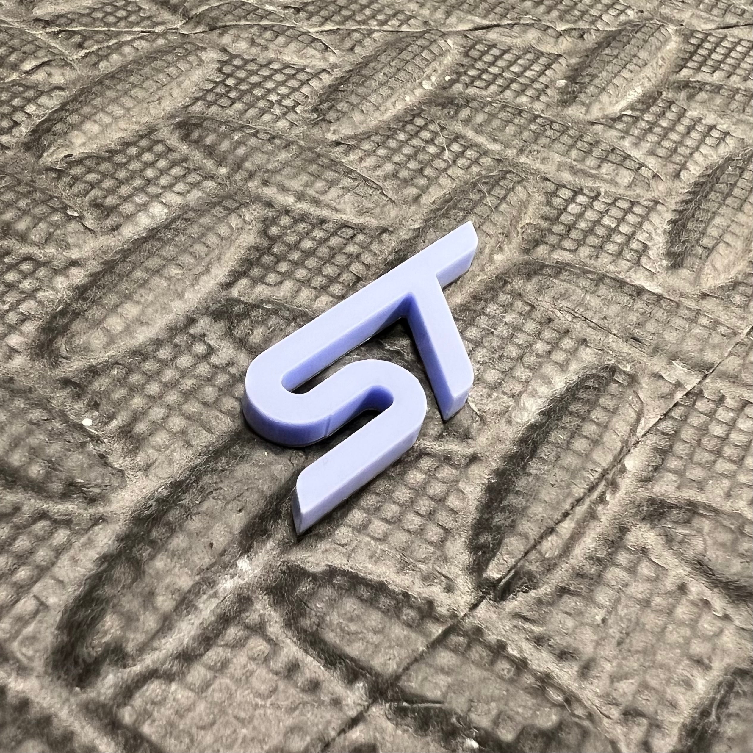 ST Logo Acrylic Badge in Lilac