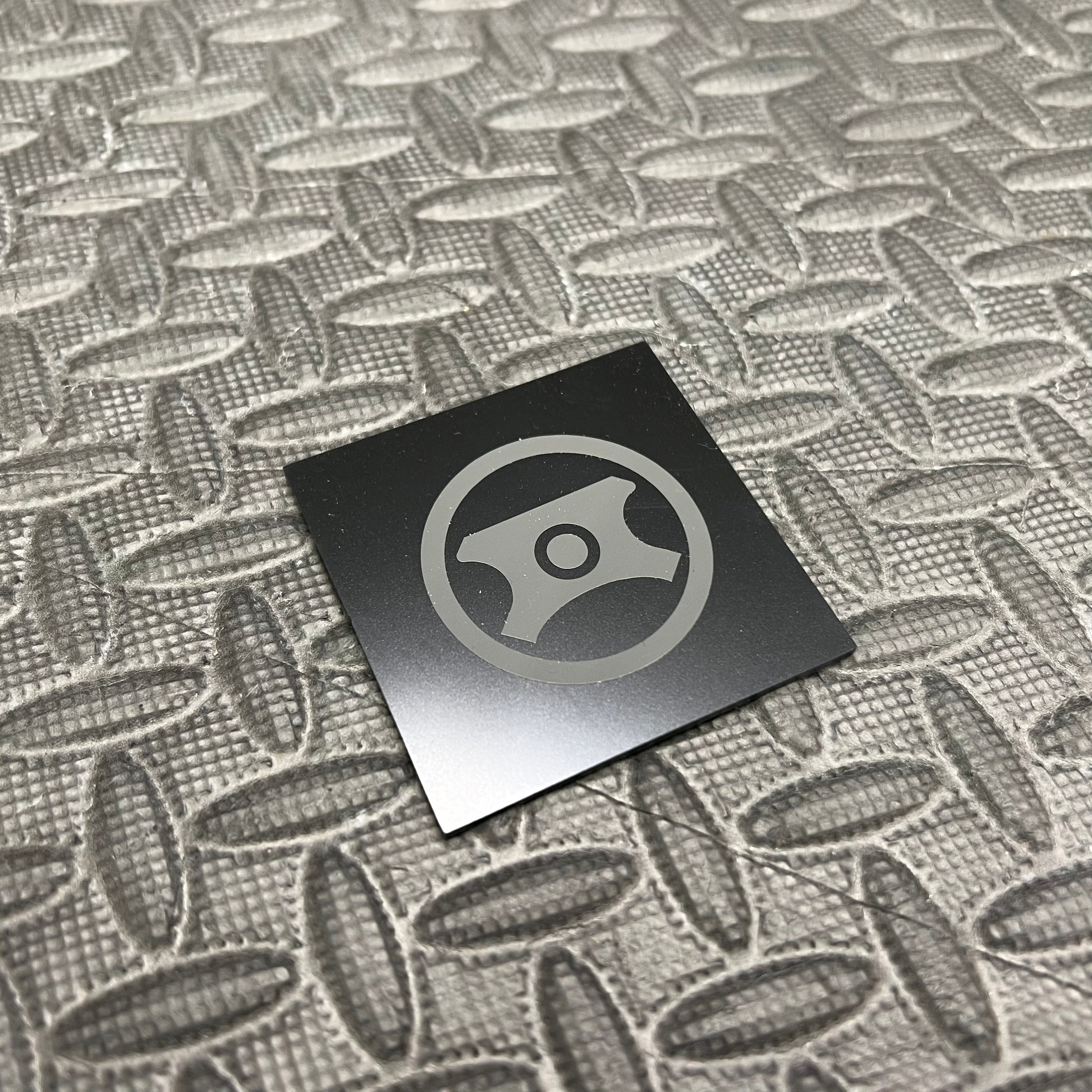 Autocollant en vinyle pour capuchon de direction assistée