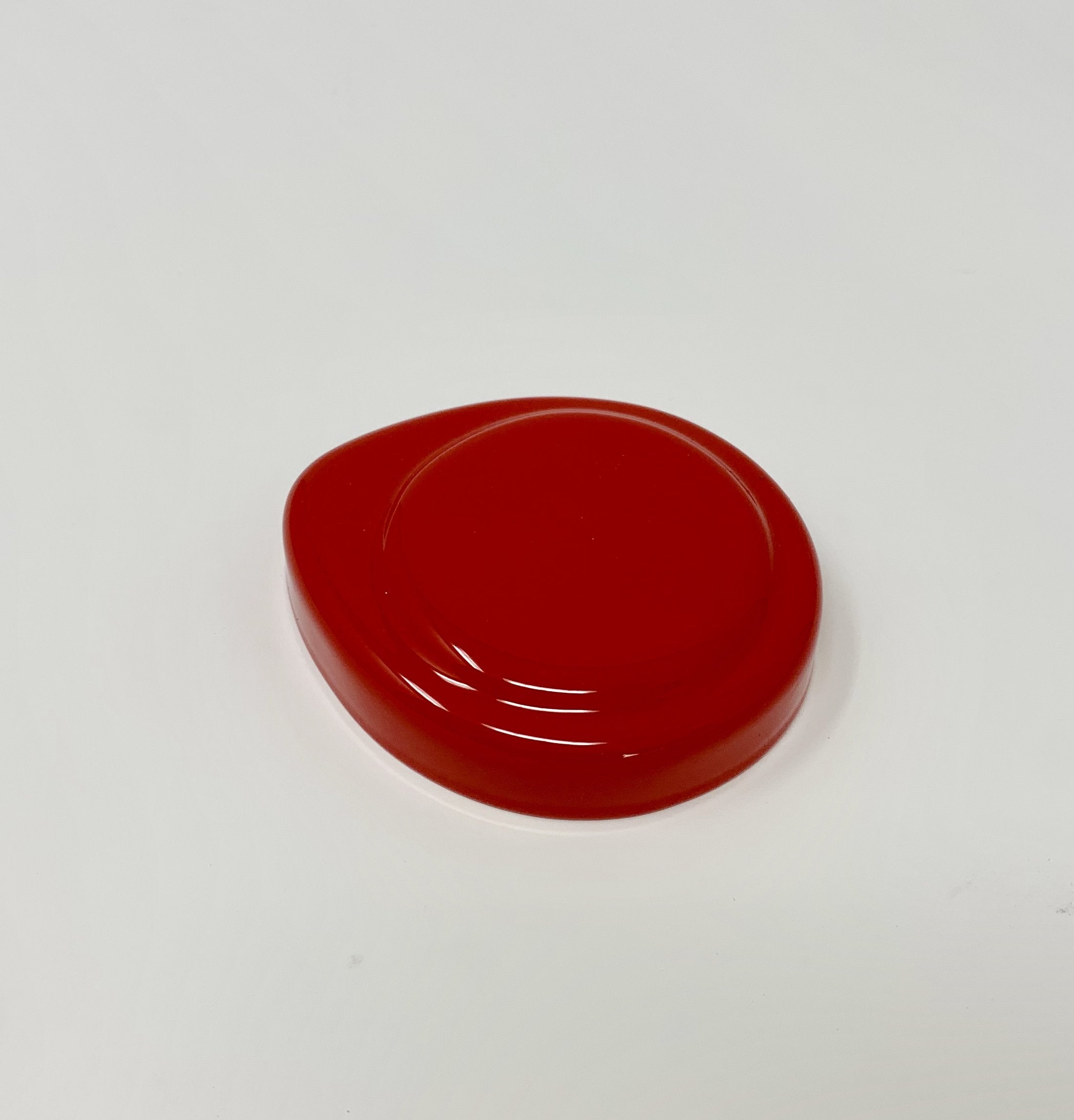 A red Proform washer bottle cap cover for Ford Fiesta Mk7/7.5.