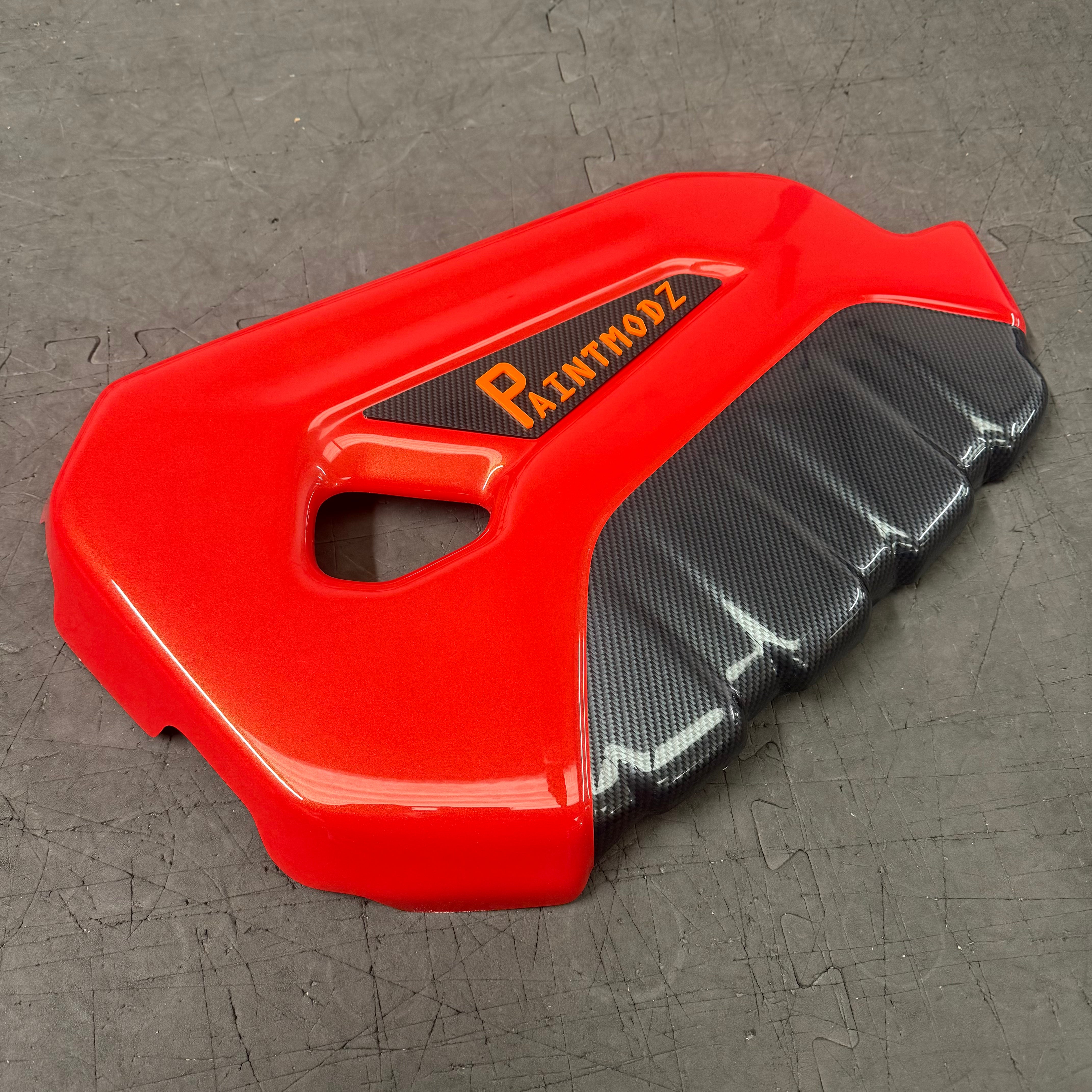 Proform Engine Cover - Fiesta Mk7.5 ST180 / ST200, Painted Molten Orange with Deluxe Carbon Fibre Effect Front. Orange/ Deluxe Carbon Fibre Effect Badge
