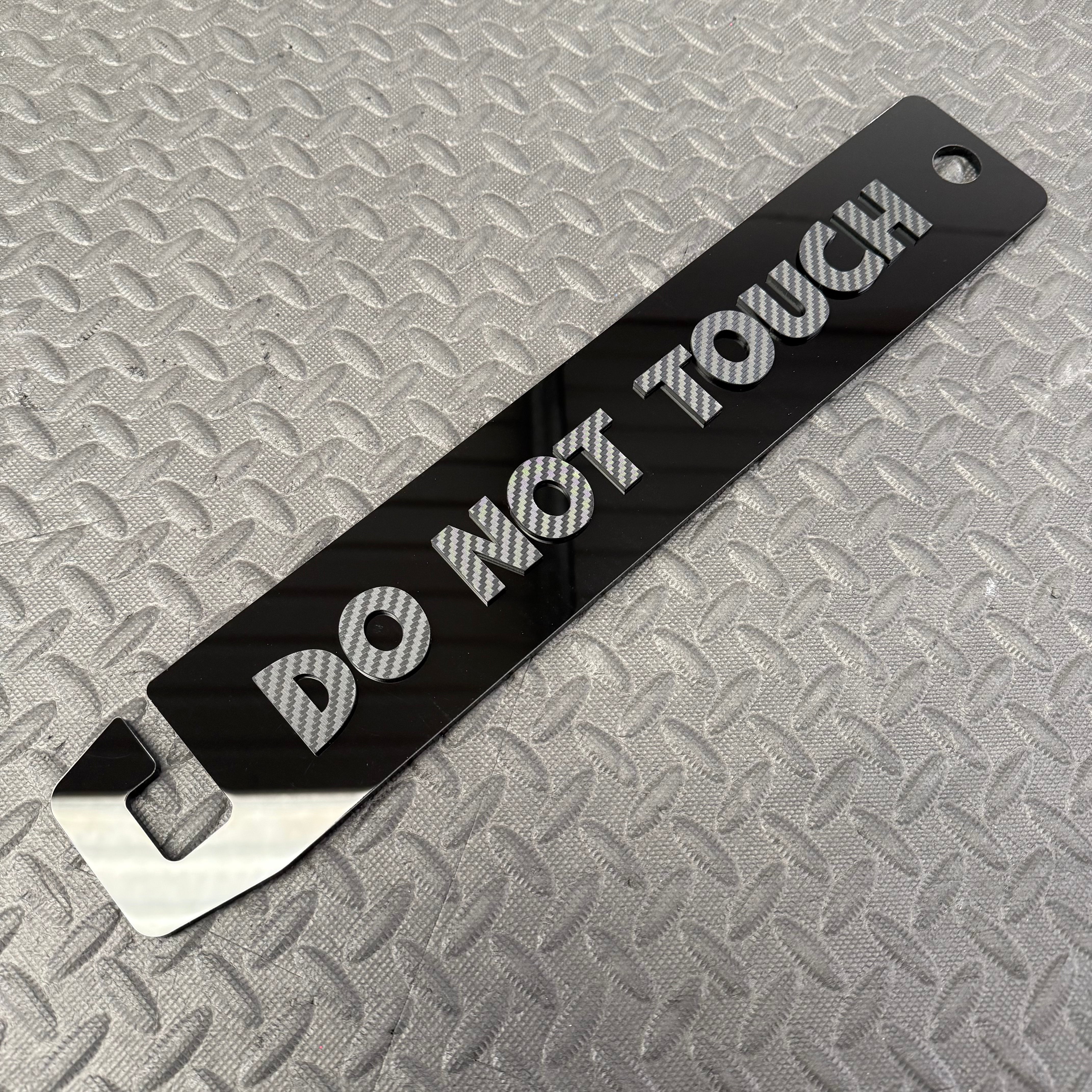Universal Bonnet Prop - Do Not Touch (4D Acrylic) - Gloss Black With Carbon Fibre Effect Lettering Colour