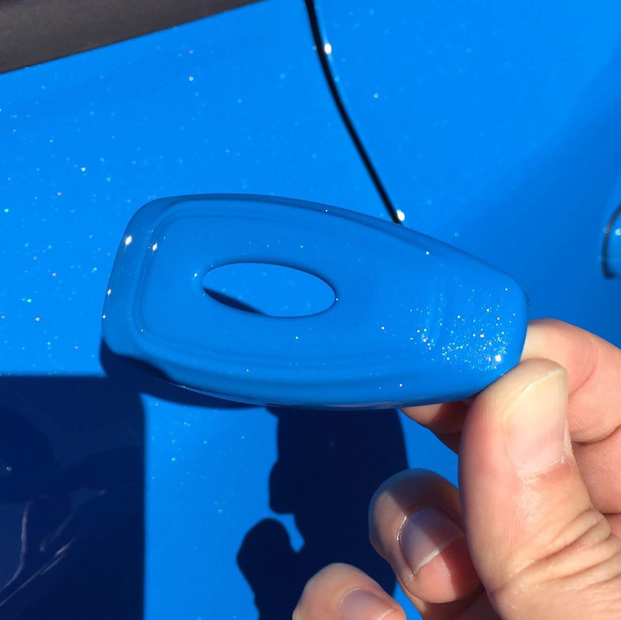 Custom Painted Ford 'Keyless Start' Key Cover next to car